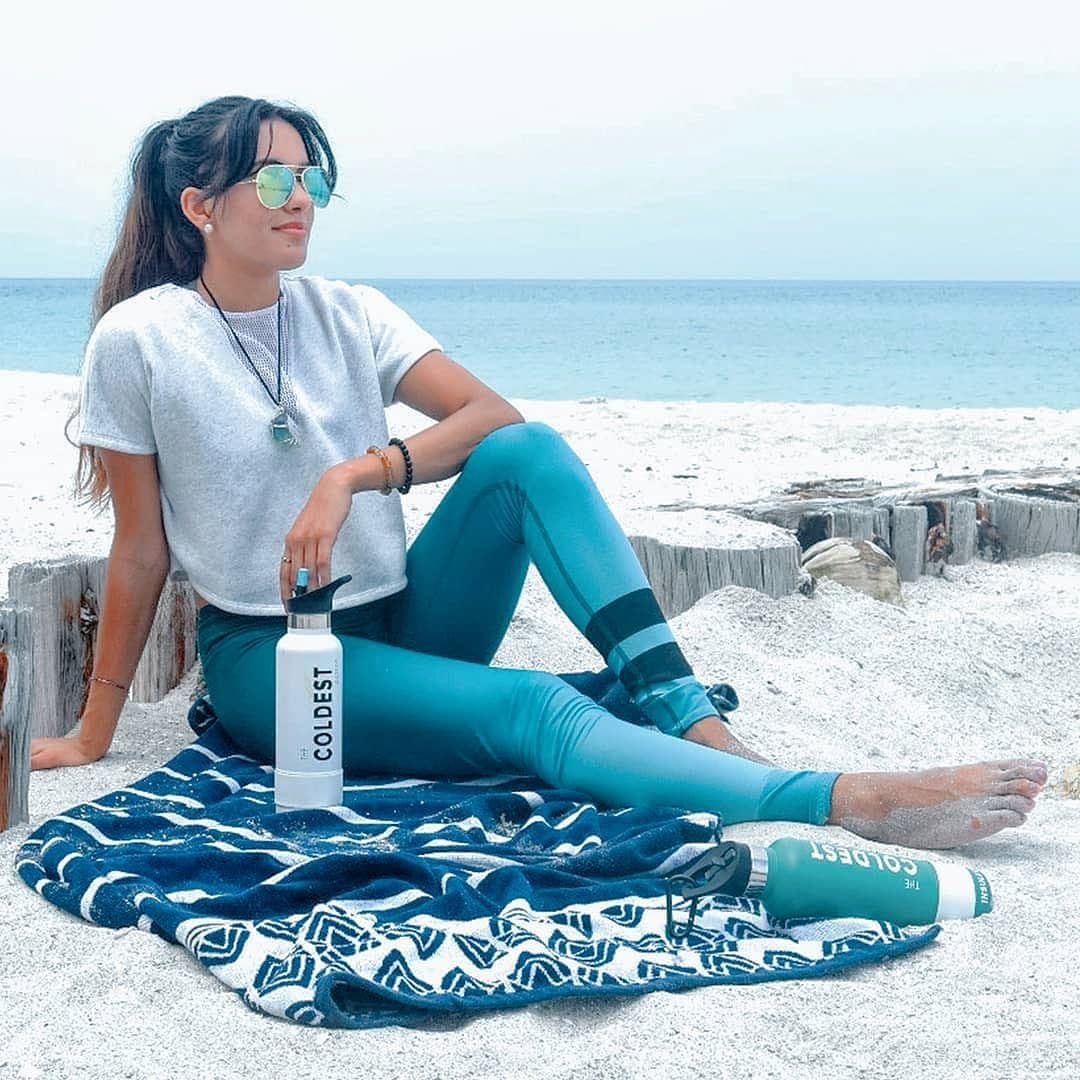 Sitting on the beach with a Coldest bottle