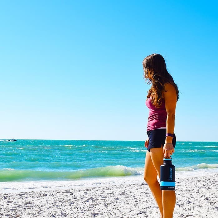 Walking the shoreline with a Coldest bottle
